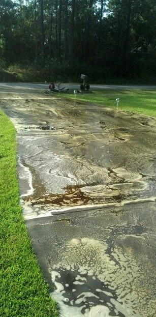 Driveway before pressure washing
